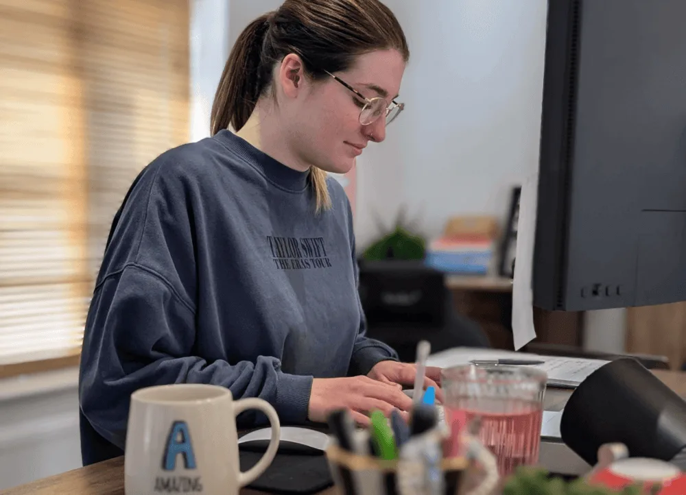 SEO degree apprentice Victoria reviewing analytics at her desk